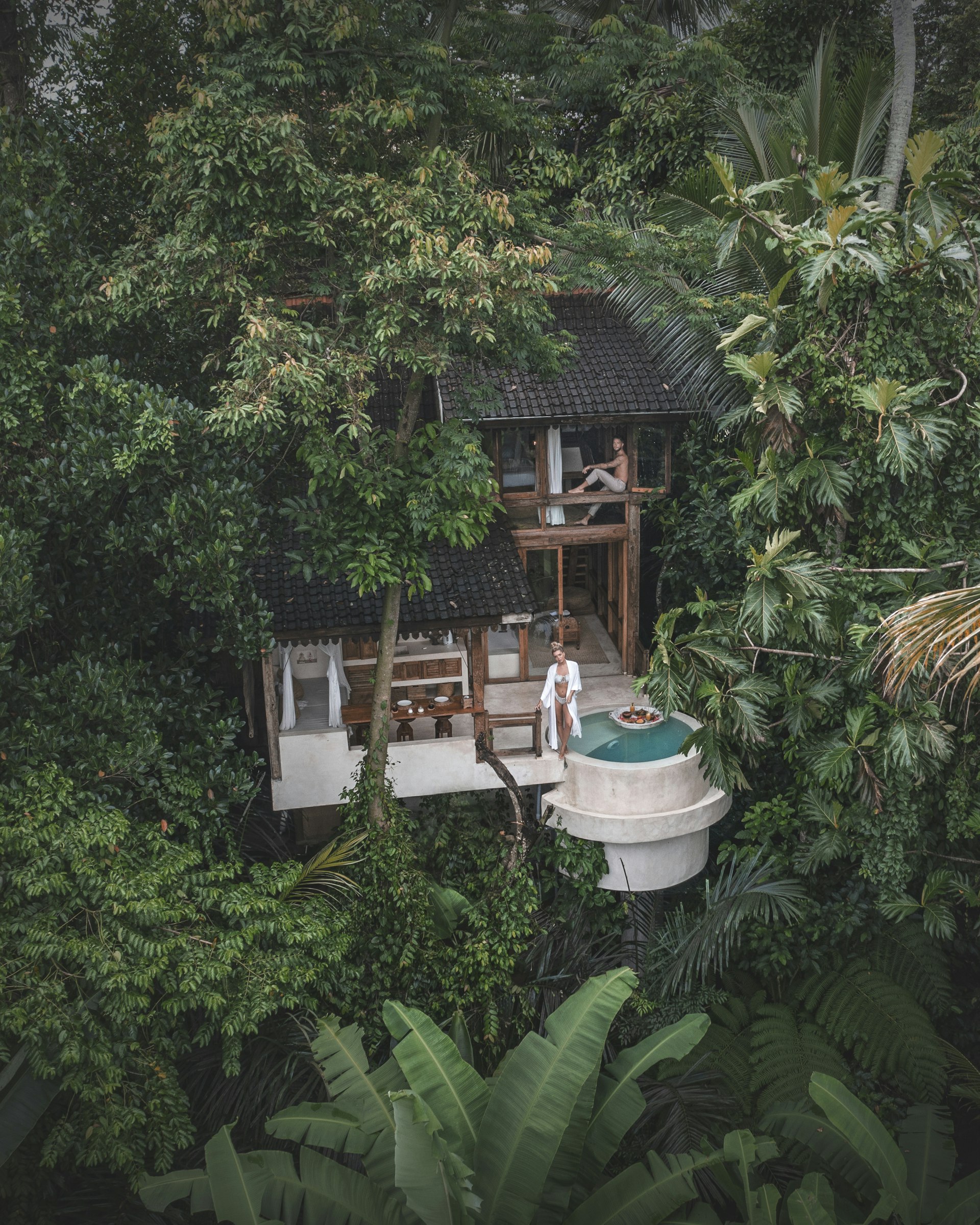 Couple enjoying luxury lifestyle at private wilderness estate at sunset